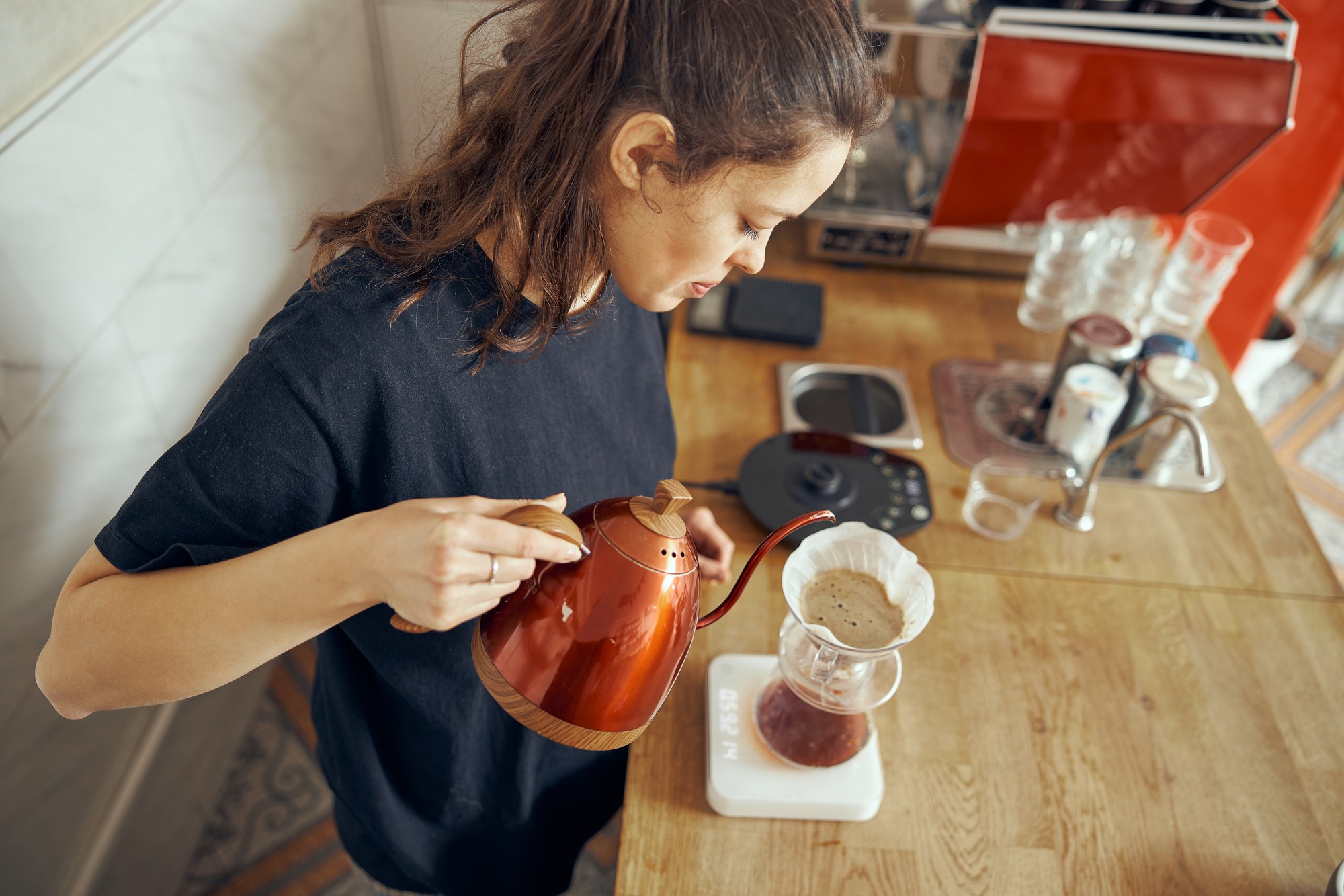 Student tasting a sauce in a workshop